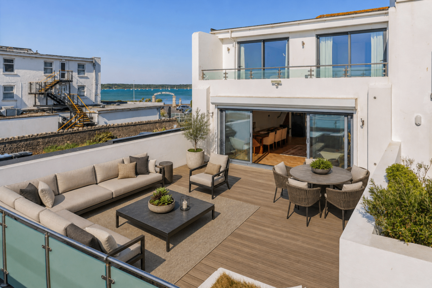 Harbour-side terrace with outdoor lounge and dining