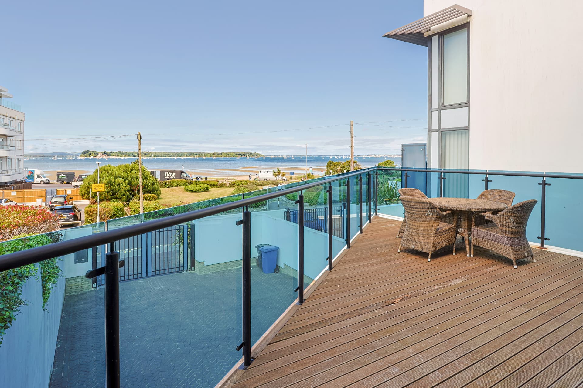 Large timber balcony overlooking the harbour and beach