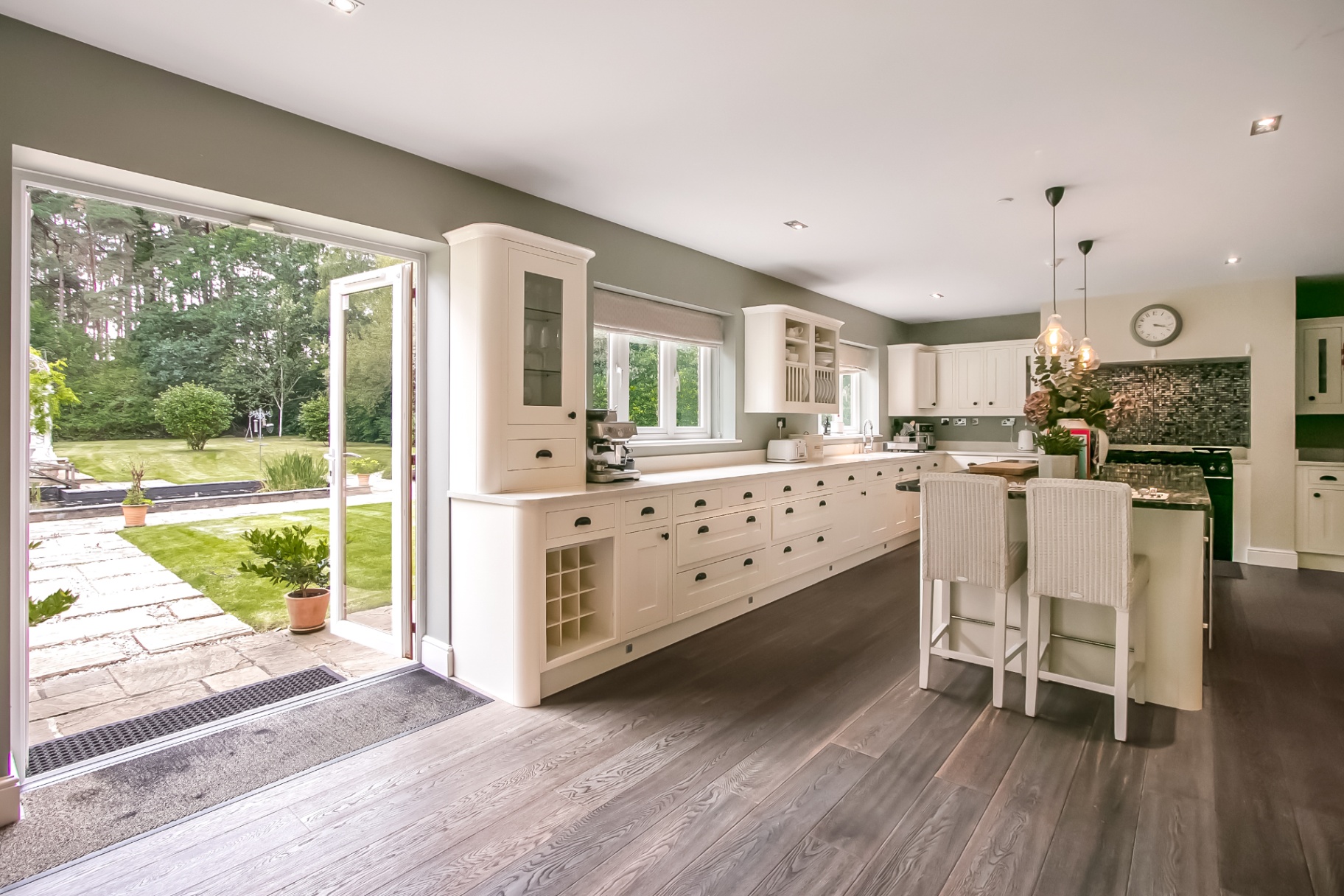 Kitchen opening onto the garden through French doors